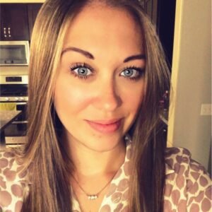 CEO Gabrielle Jeuck headshot wearing a leopard patterned shirt.