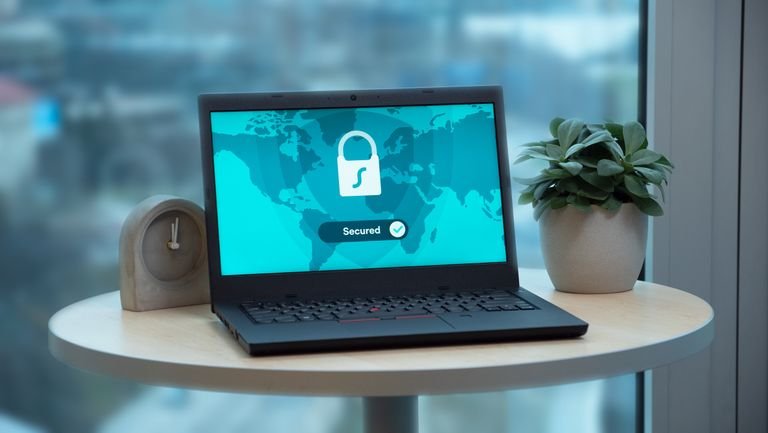 Laptop screen displaying a security lock icon, representing ongoing website security monitoring and maintenance for small business websites.
